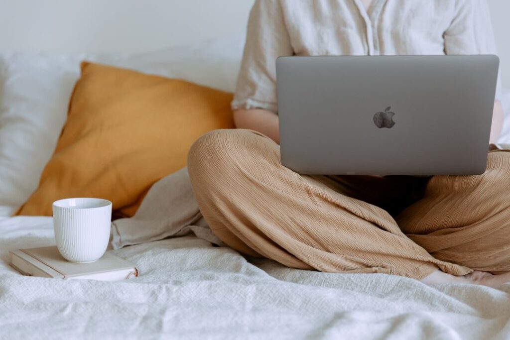 Woman on the computer drinking coffee and taking assessment looking for counseling for me