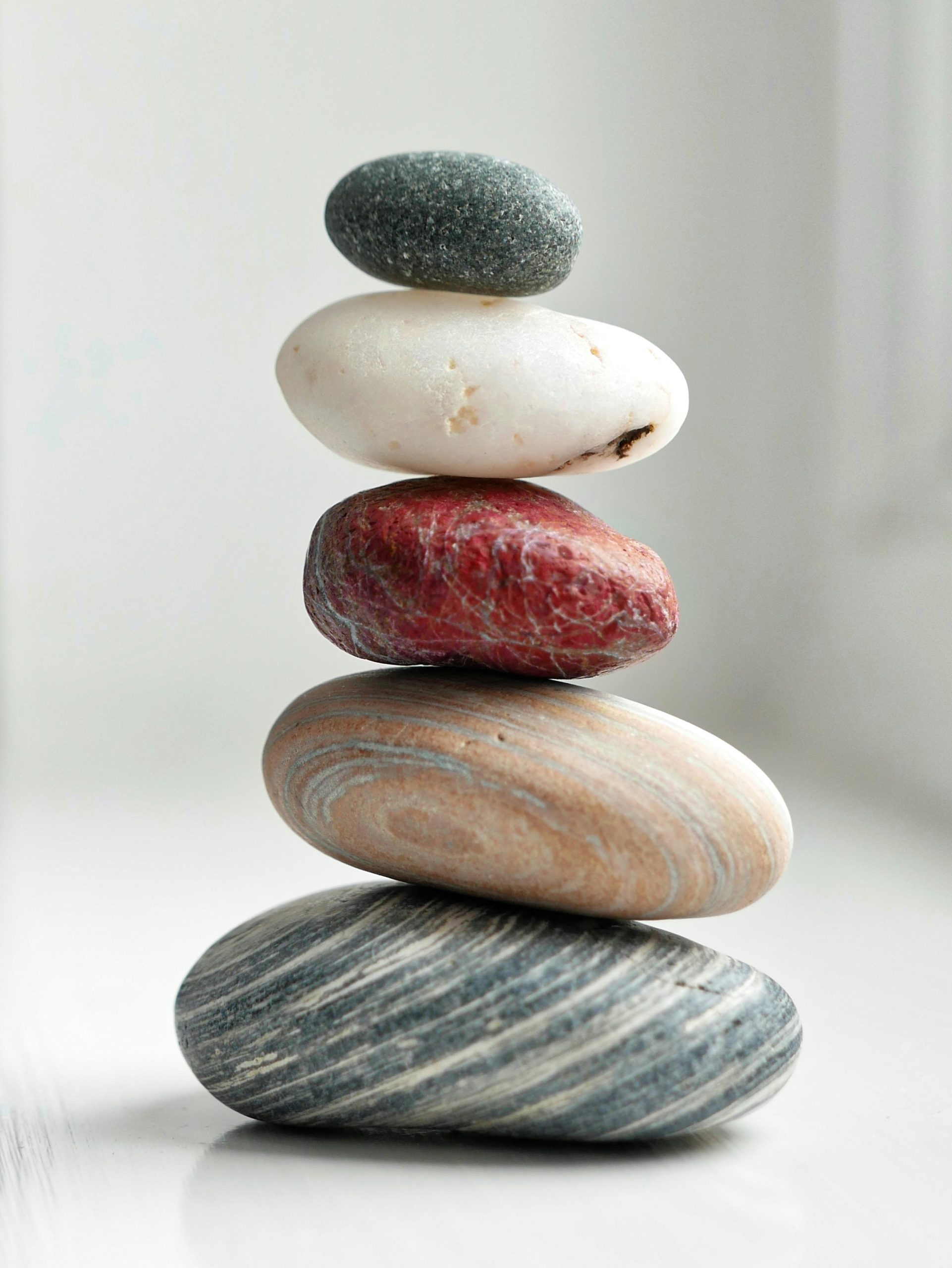 stack of rocks showing finding balance with the help of Christian Life Coach